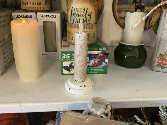 Silicone dipped candles on wood base